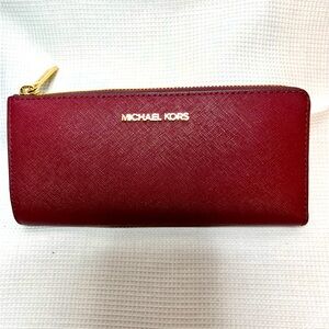 MICHAEL KORS
Leather Continental Wallet 
Oxblood 
Like New without tags